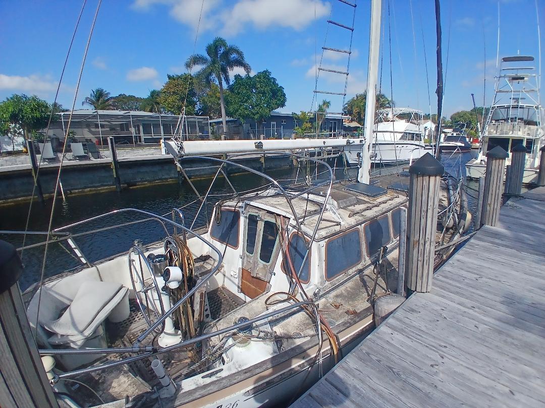 Abandoned vessel at a marina dock