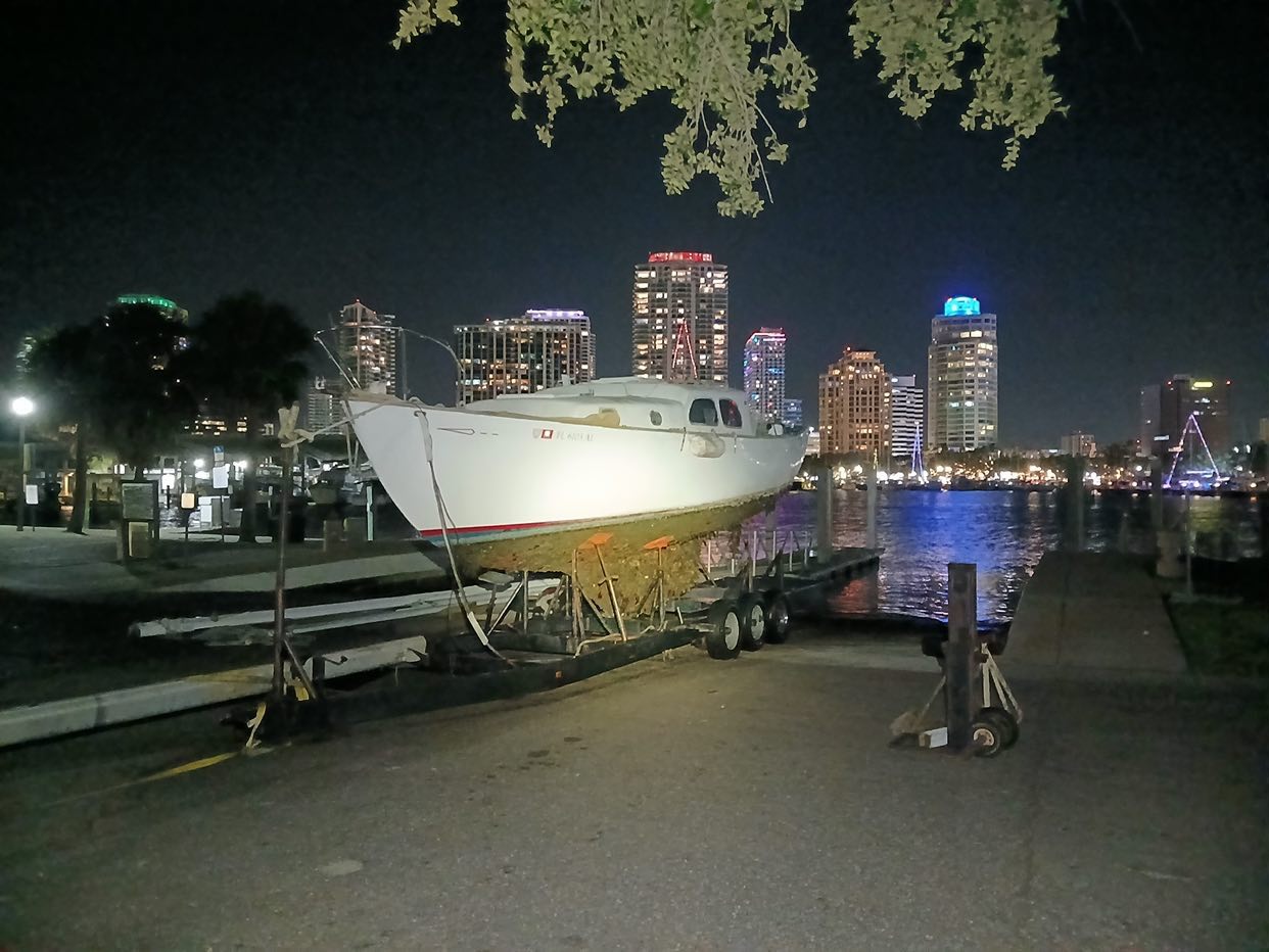 Nighttime trailer pickup of abandoned vessel from water