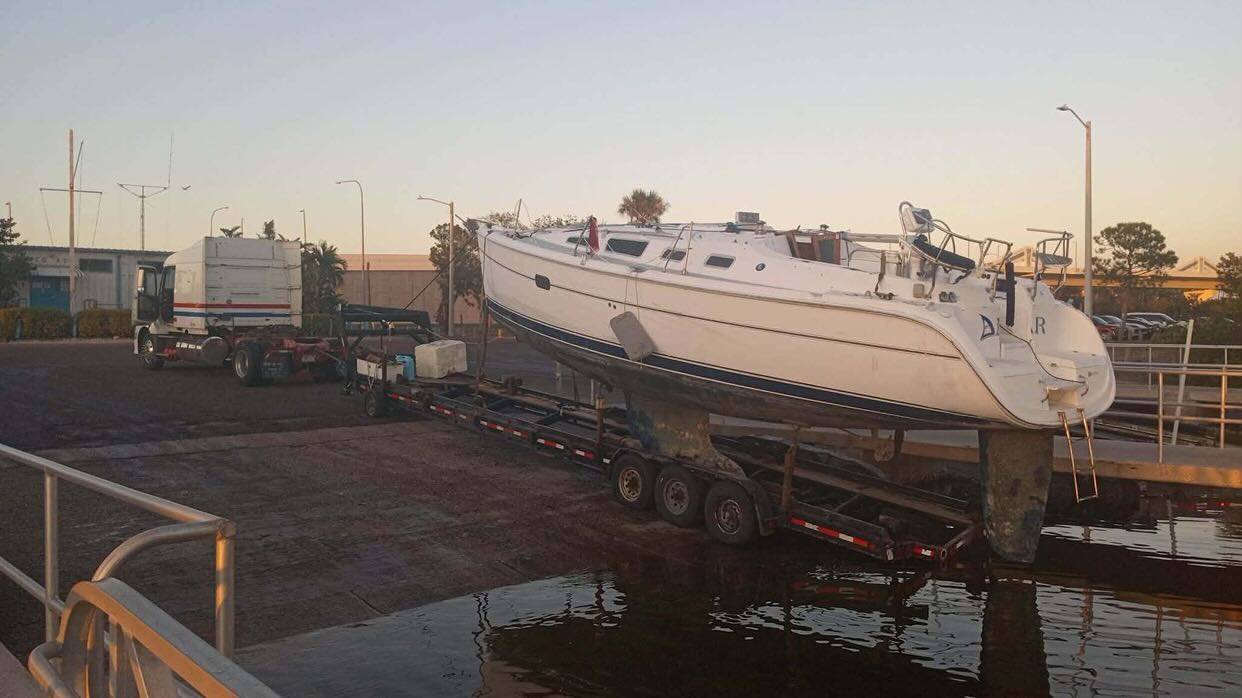 Trailer hauling a boat out of the water