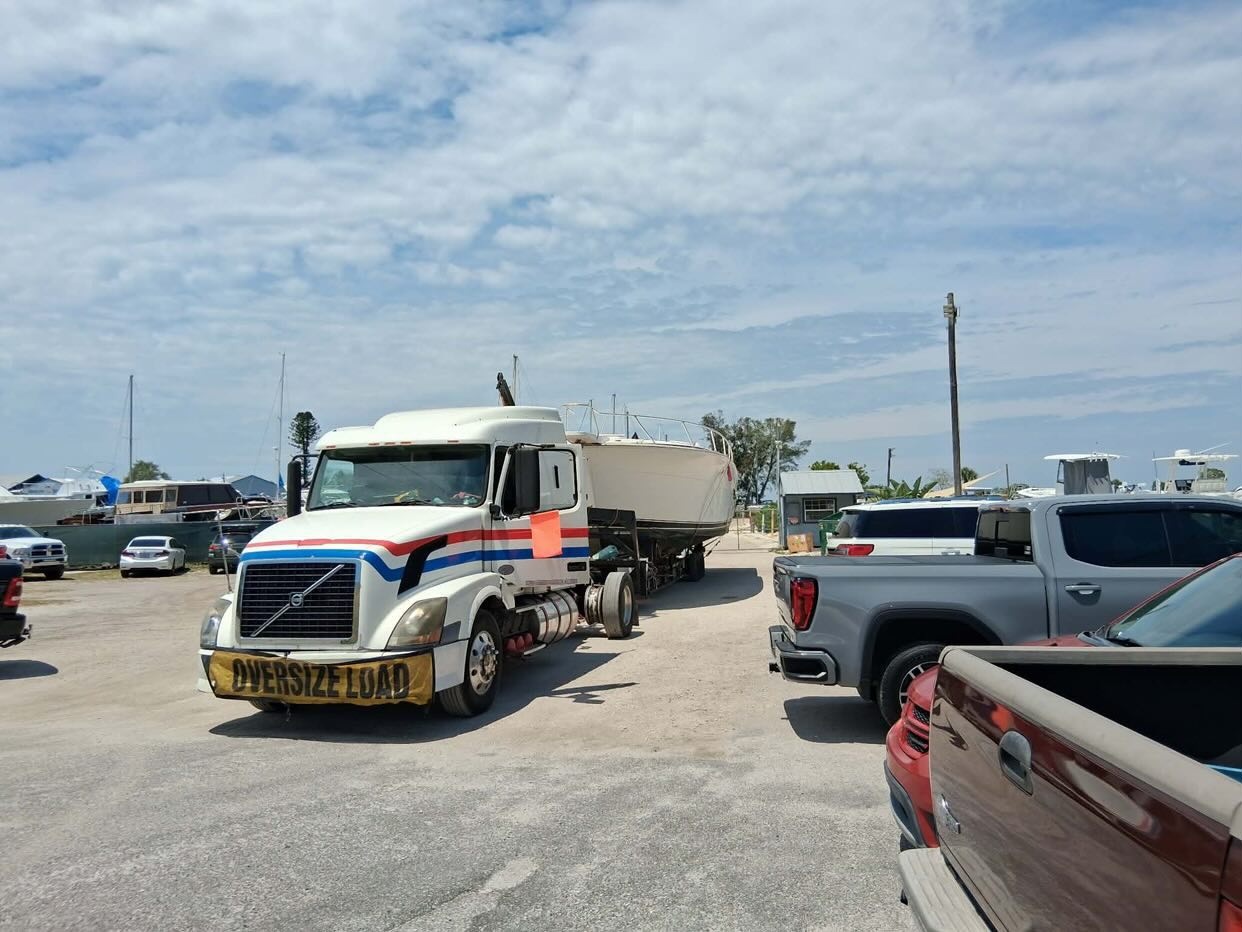 Oversize trailer hauling a large boat